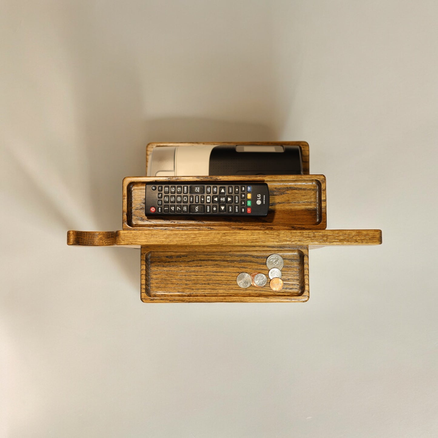 A top view of the CPAP Smart Stand made by Custom Cave Works.  The stand is made from solid Oak wood and shows a very organized view of the catch-all trans, including the one on the back side of the stand.  