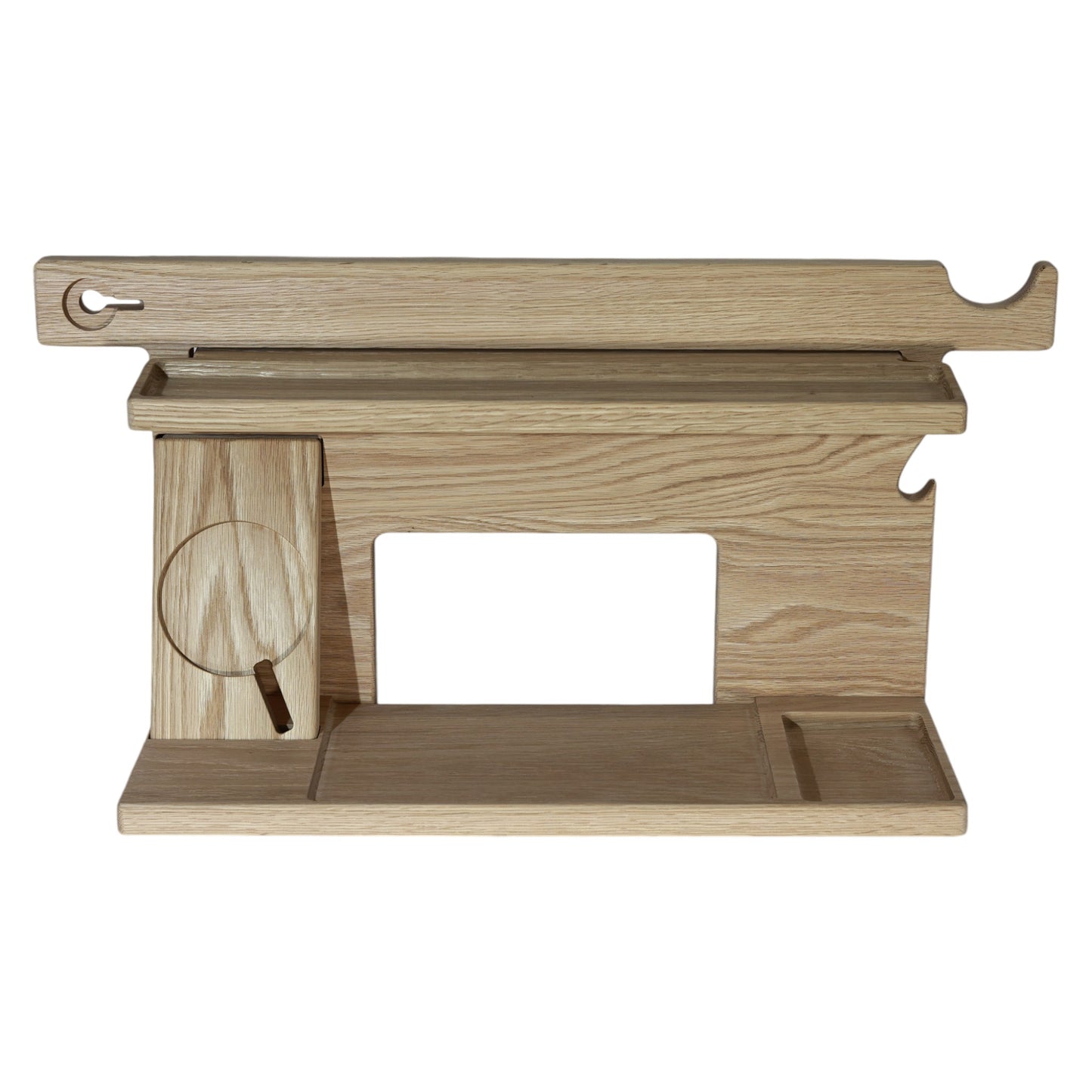 An empty CPAP Smart Stand made by Custom Cave Works.  The stand is on a white background and includes places to put your smartphone, smartwatch, change, keys and wallet.  The stand is sold oak wood that has a satin finish.  